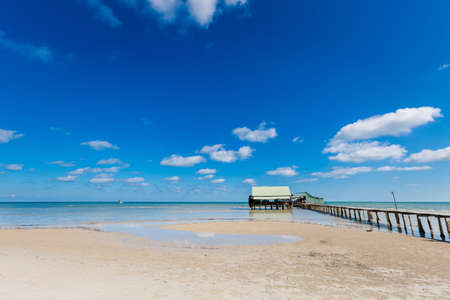 Local seafood restaurant in beautiful fishermans village Ham Ninh, tropical Phu Quoc island (Bai Thom area) in Vietnam. Landscape taken during sunny day with blue sky.の写真素材
