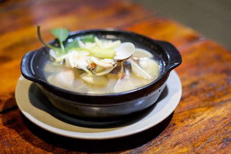 Delicious fresh prepared mussels, Chip Chip clams. Traditional vietnamese cuisine served in harbour...