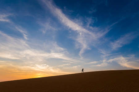 Red sand dunes in Mui Ne, Phan Tiet area in Vietnam. Landscape viewed during sunset.の写真素材