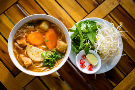 Delicious fresh prepared Bun Bo Hue chay. Vegetarian vietnamese soup served in local restaurant of...