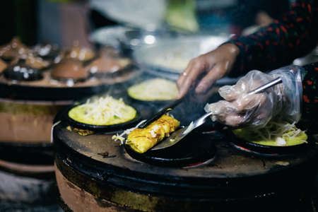 Delicious Banh Can in local restaurant. Traditional vietnamese pancake served in Mui Ne, Vietnam.