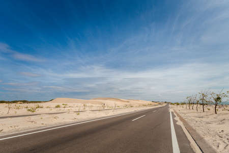 Vietnam coastal motorbike trip from Mui Ne to Phan Rang. Landscape with blue sky during sunny day on...