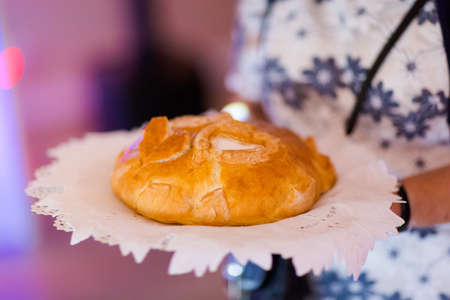 Wedding bread with salt detail on hands- traditional polish inviting to Bride and Groom.