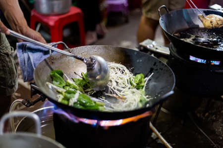 Delicious colorful local food vegan stir fry on the market. Traditional vietnamese cuisine in Ho Chi Minh, Vietnam.の写真素材