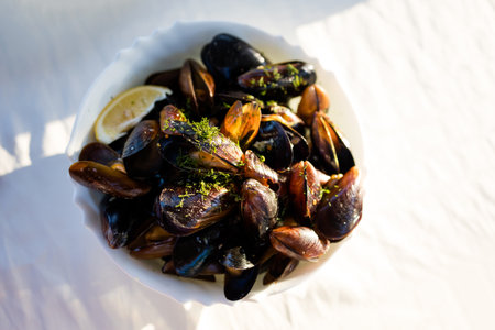 Delicious colorful local food fresh cooked mussels in a restaurant. Traditional bulgarian cuisine in Bulgaria.の写真素材