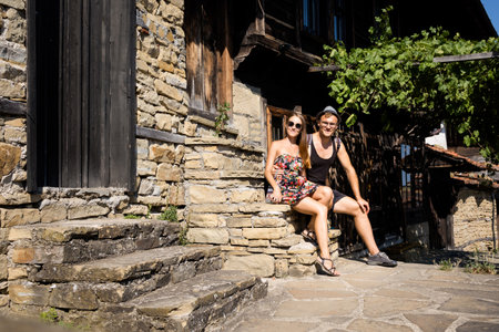 Summer landmark photo of old and authentic bulgarian Zheravna village. Young beautiful couple in Bulgariaの写真素材
