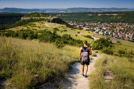 Summer beautiful photo of young male tourist in Ovech Fortress in Provadia, Bulgaria, Varna province. Landscape with blue skyのeditorial素材