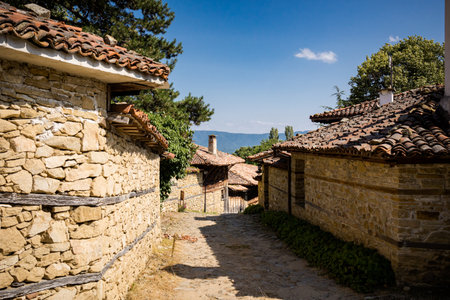 Summer landmark photo of old and authentic bulgarian Zheravna village. Landscape with blue sky in Bulgariaのeditorial素材