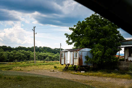 Summer photo of village and lake in abandoned Zhrebchevo Bulgaria. Landscape with blue skyの写真素材