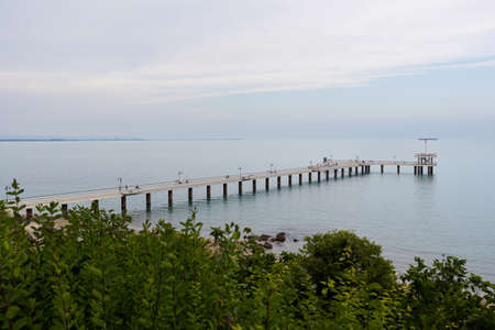 Summer in beautiful Burgas city in Bulgaria. Landscape with pier above the sea