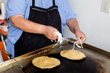 Man preparing Fresh Huaraches in local restaurant near Teotihuacan. Traditional mexican cuisine made of fresh ingredients.の写真素材