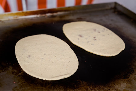 Man preparing Fresh Huaraches in local restaurant near Teotihuacan. Traditional mexican cuisine made of fresh ingredients.の写真素材