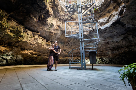 Beautiful architecture of the smallest volcano in the world - Cuexcomate geyser in Puebla, Mexico. Pretty caucasian couple posing together.の写真素材