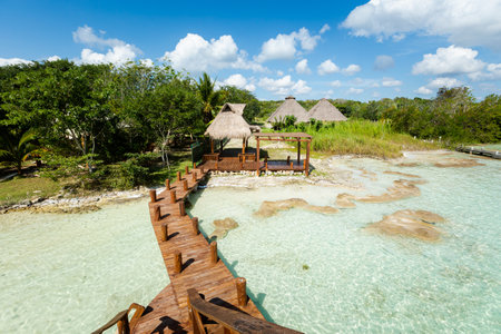 Beautiful landscape - wooden pier in Laguna Bacalar in Mexico during kayak trip.の写真素材