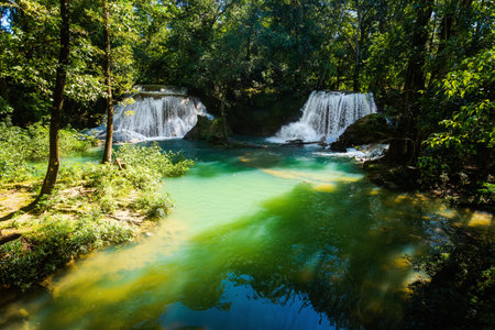 Beautiful nature in Roberto Barrios cascadas park, Palenque in Mexico. Vivid landscape photo with lush green and crystal water during sunny day.の写真素材