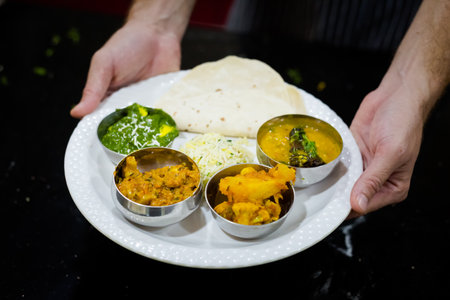 Traditional way of serving indian food. Picture of traditional India cuisine made of fresh ingredients taken during cooking class in Goaの写真素材