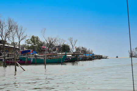Fisher boats line up on beachの写真素材