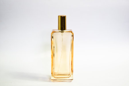 Transparent Gold Bottle Perfume isolated white background for mock up designの写真素材