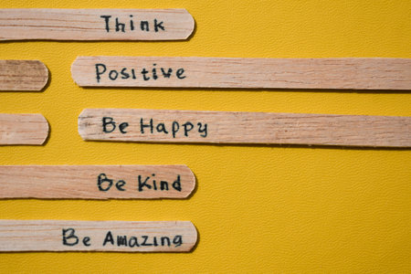 stick of ice cream with the words Think Positive, Be happy, Be Kind, Be Amazing. Motivational quotes, optimism, positive words. Isolated on backgroundの写真素材