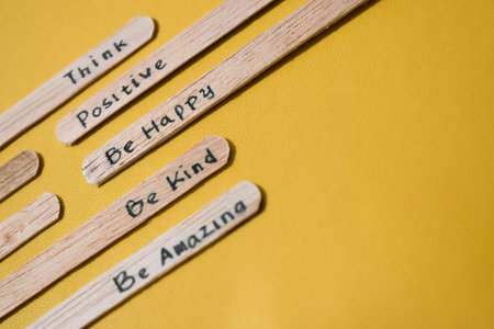 stick of ice cream with the words Think Positive, Be happy, Be Kind, Be Amazing. Motivational quotes, optimism, positive words. Isolated on backgroundの写真素材