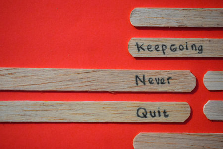 stick of ice cream with the words Keep going, Never quit. Motivational quotes, optimism, positive words. Isolated on backgroundの写真素材