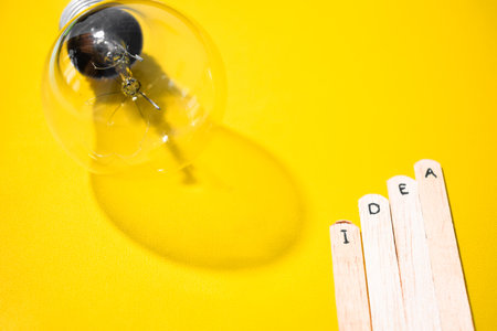 stick of ice cream with the words Idea and lightbulb. Motivational quotes, optimism, positive words. Isolated on backgroundの写真素材