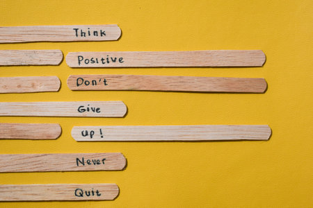 stick of ice cream with the words Think Positive, Donât give up, Never quit. Motivational quotes, optimism, positive words. Isolated on backgroundの写真素材