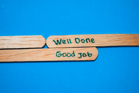 stick of ice cream with the words Well done and Good Job. Motivational quotes, optimism, positive words. Isolated on backgroundの写真素材