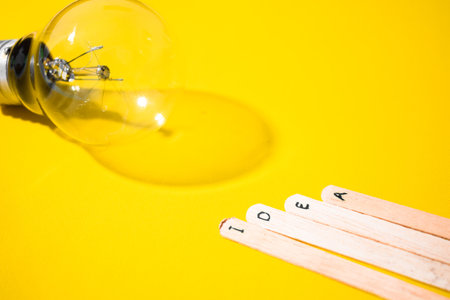 stick of ice cream with the words Idea and lightbulb. Motivational quotes, optimism, positive words.の写真素材