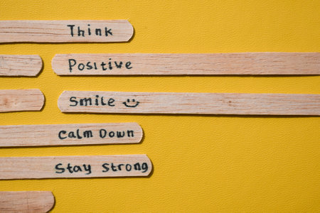 stick of ice cream with the words Think Positive, Smile, calm dowm, Stay strong. Motivational quotes, optimism, positive words. Isolated on backgroundの写真素材