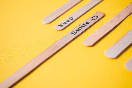 stick of ice cream with the words Keep Smile. Motivational quotes, optimism, positive words. Isolated on backgroundの写真素材