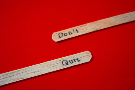 stick of ice cream with the words Don't quit. Motivational quotes, optimism, positive words. Isolated on backgroundの写真素材