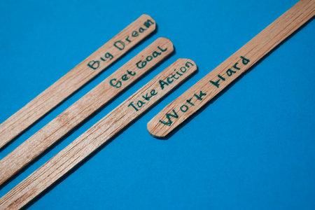 stick of ice cream with the words Big dream, Get goal, Take action, Work hard. Motivational quotes, optimism, positive words. Isolated on backgroundの写真素材