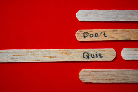 stick of ice cream with the words Don't quit. Motivational quotes, optimism, positive words. Isolated on backgroundの写真素材