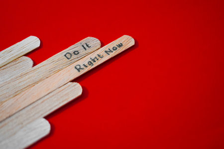 stick of ice cream with the words Do it right now. Motivational quotes, optimism, positive words. Isolated on backgroundの写真素材