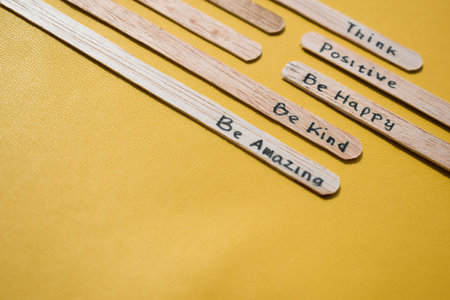 stick of ice cream with the words Think Positive, Be happy, Be Kind, Be Amazing. Motivational quotes, optimism, positive words. Isolated on backgroundの写真素材