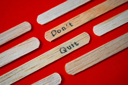 stick of ice cream with the words Don't quit. Motivational quotes, optimism, positive words. Isolated on backgroundの写真素材