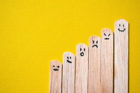 stick with expression emotion, smile, angry, surprise. Motivational quotes, optimism, positive words. Isolated on backgroundの写真素材