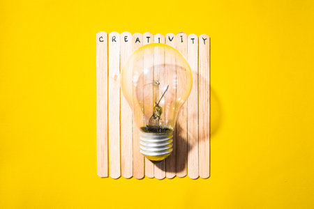 stick of ice cream with the words Creativity and lightbulb. Motivational quotes, optimism, positive words. Isolated on backgroundの写真素材