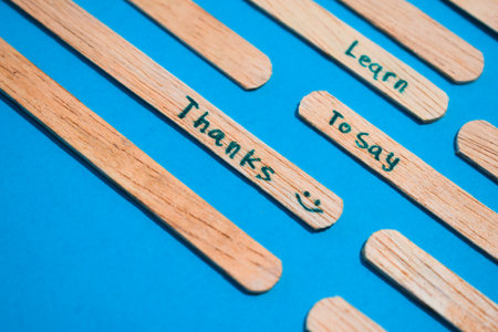 stick of ice cream with the words Learn to say Thanks. Motivational quotes, optimism, positive words. Isolated on backgroundの写真素材