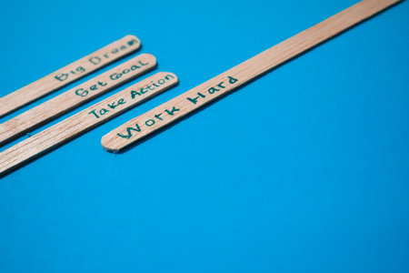 stick of ice cream with the words Big dream, Get goal, Take action, Work hard. Motivational quotes, optimism, positive words. Isolated on backgroundの写真素材