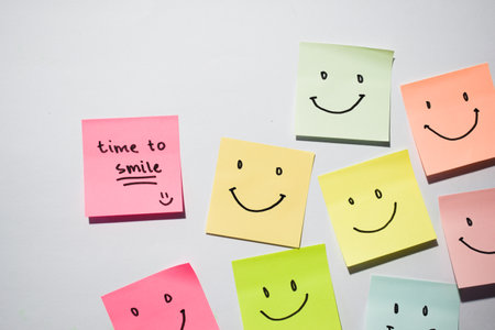 Time to smile and smiley emoticon on sticky notes. Motivational words for personal development,...