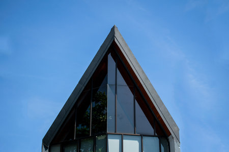 Symmetrical triangle roof minimalist modern buildingの写真素材