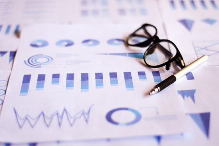 Close up paperwork with printed statistic chart. Financial, account, statistics and business data concept.の写真素材