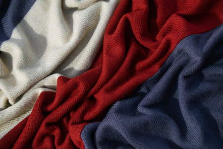 Triple color grey white milk and red on knitted fabric wavy crumpled background texture.の写真素材