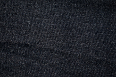 Flat view Dark grey jeans fabric texture background.の写真素材
