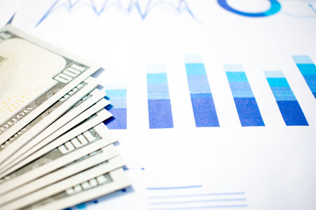 US Dollar banknote and printed statistic chart. Financial, account, statistics and financial health concept.の写真素材