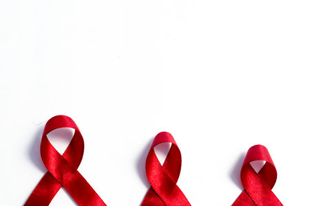 Red ribbons, HIV awareness concept, world AIDS day, world hypertension day, world cancer day with...