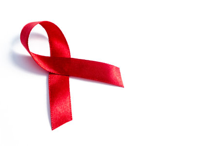 Red ribbons, HIV awareness concept, world AIDS day, world hypertension day, world cancer day with copy space over white background.の写真素材
