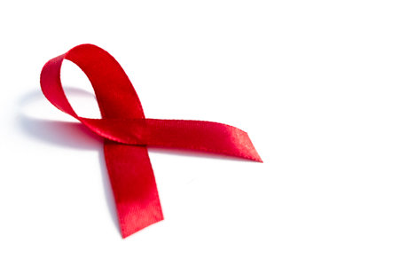 Red ribbons, HIV awareness concept, world AIDS day, world hypertension day, world cancer day with copy space over white background.の写真素材